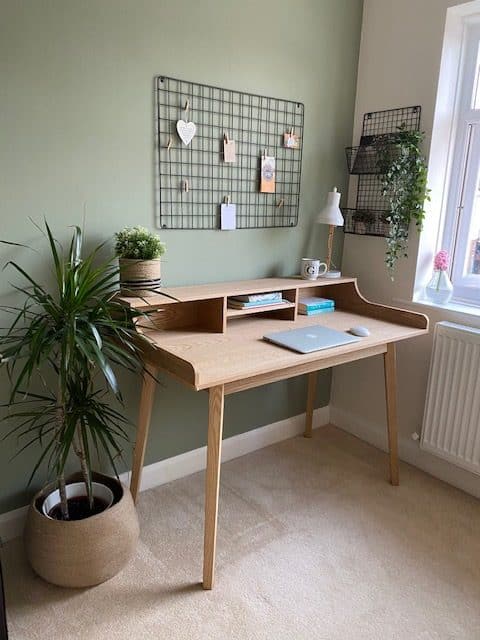 A home office desk with storage